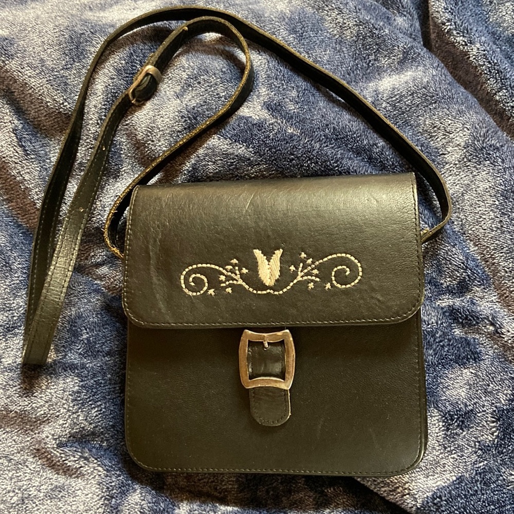 Black leather purse with white decorative stitching/embroidery